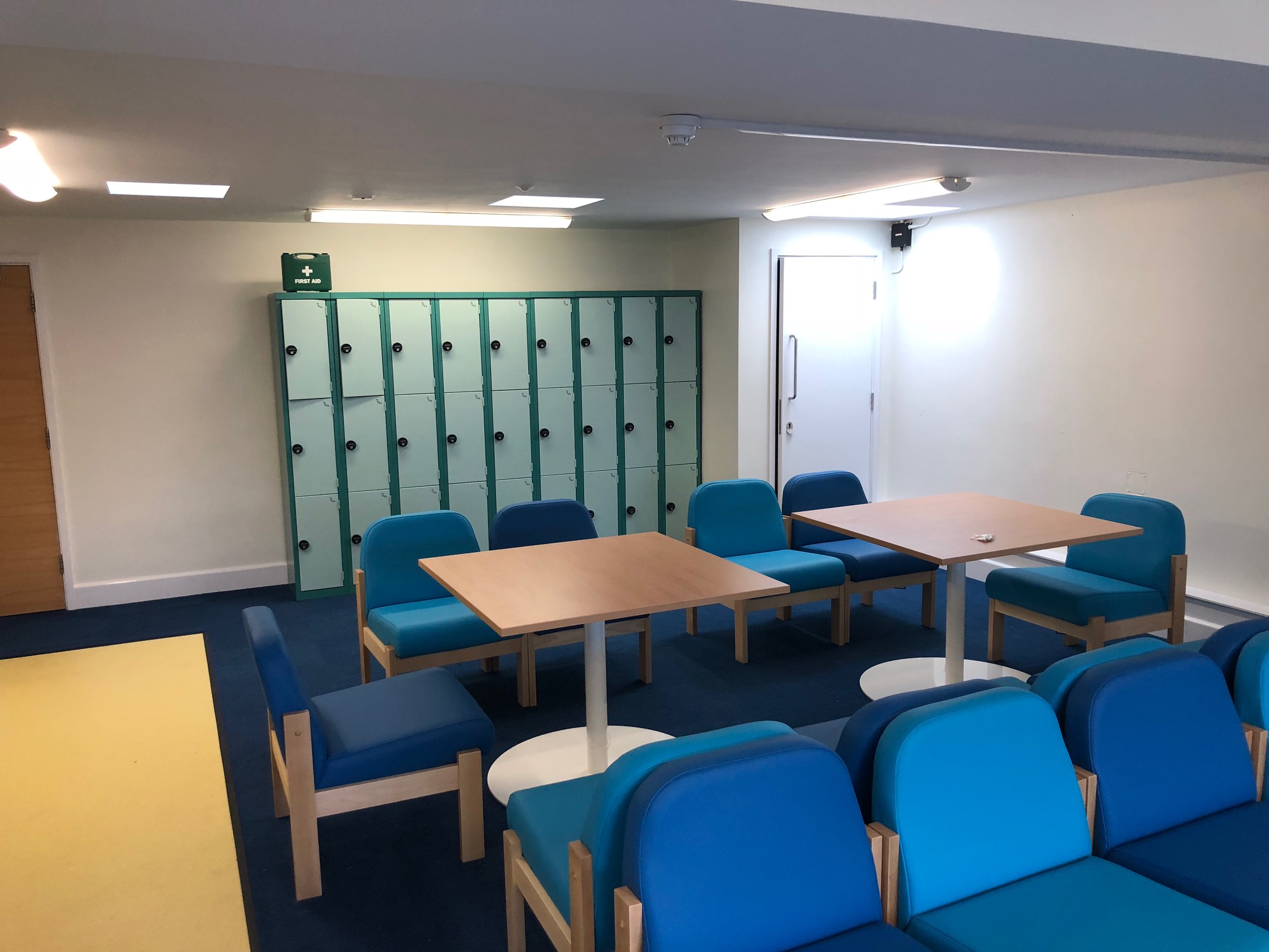 School Staff room with Blue Chairs and wooden tables