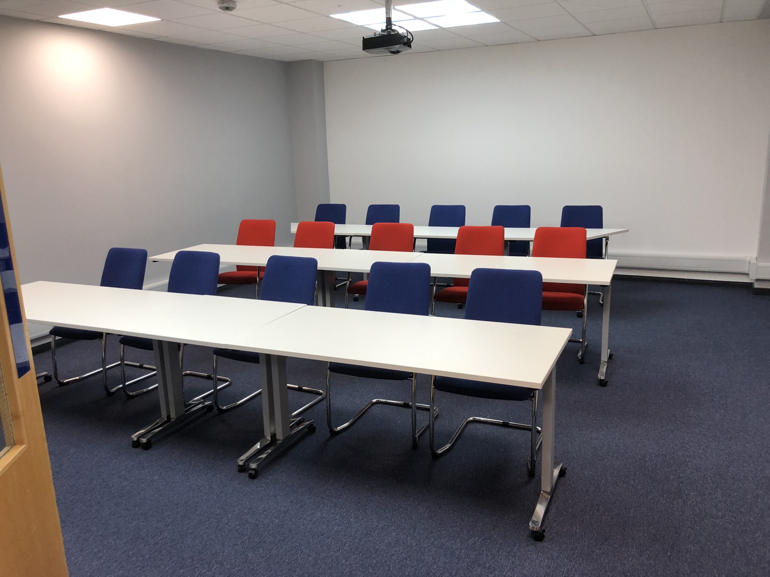 Training room with blue and red chairs