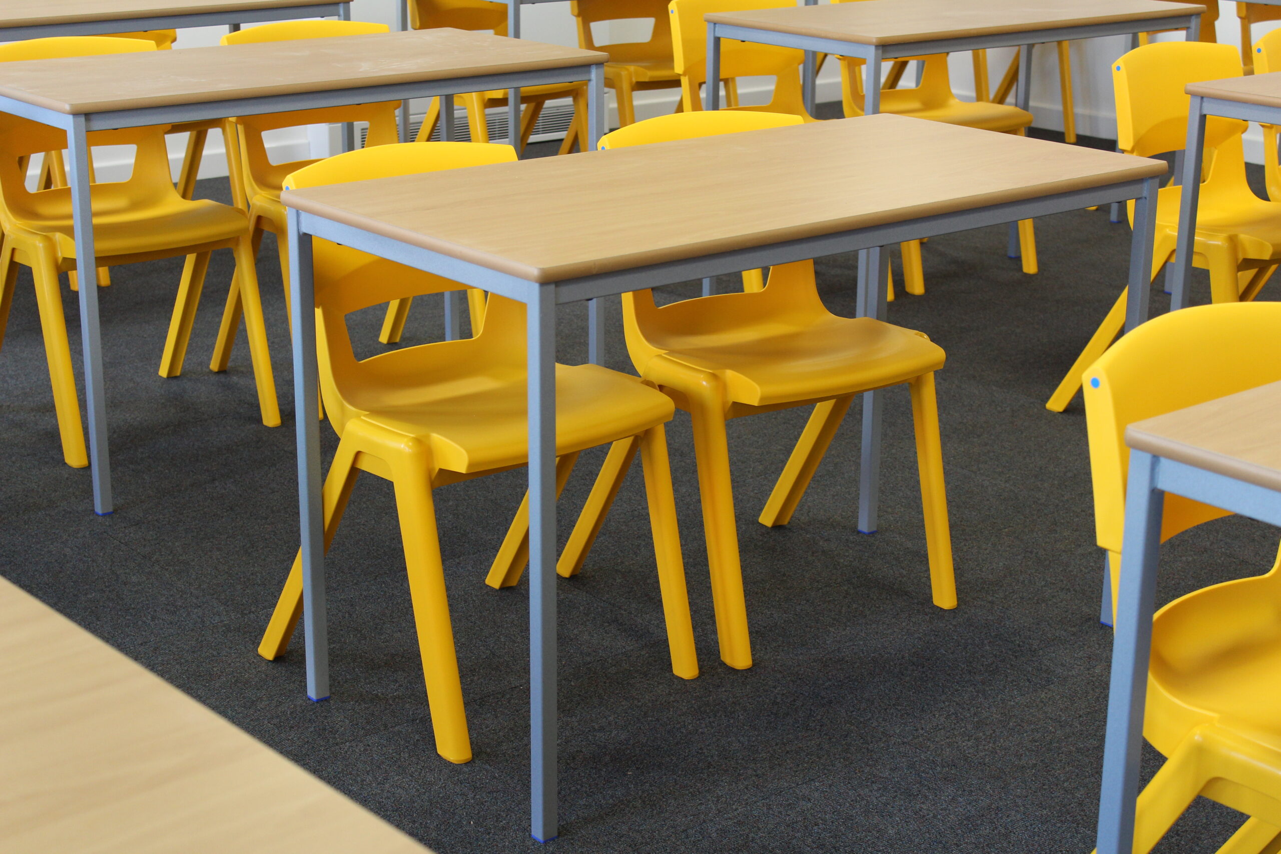 Yellow Postura Chairs and Fully Welded Classrrom Tables image 2